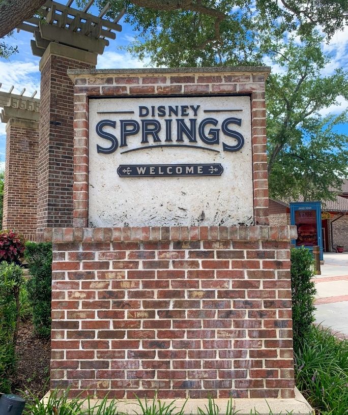 brick and concrete Disney Springs sign