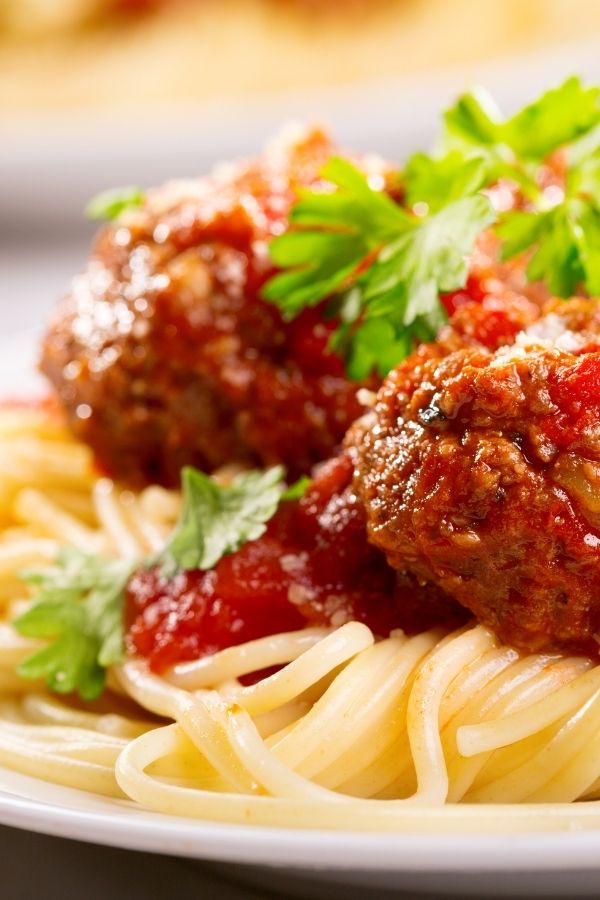 a dish of spaghetti and meatballs similar to what one might enjoy from the menu at Maria and Enzo's restaurant at Disney Springs