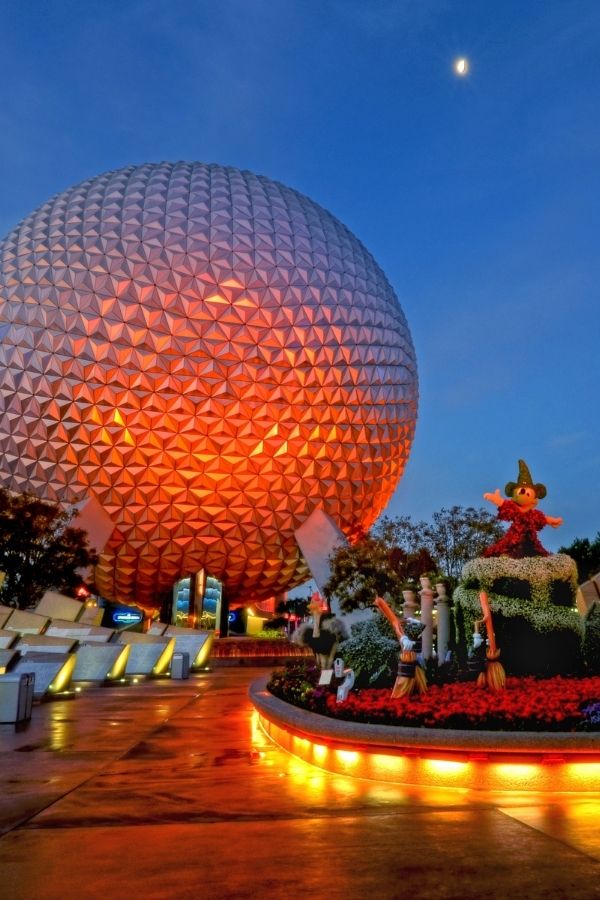 evening view of Spaceship Earth at Epcot, with orange lights shining on it