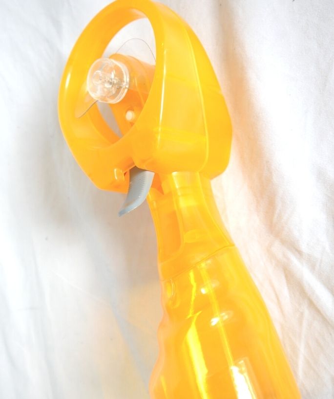 a yellow-orange misting fan for disney heat
