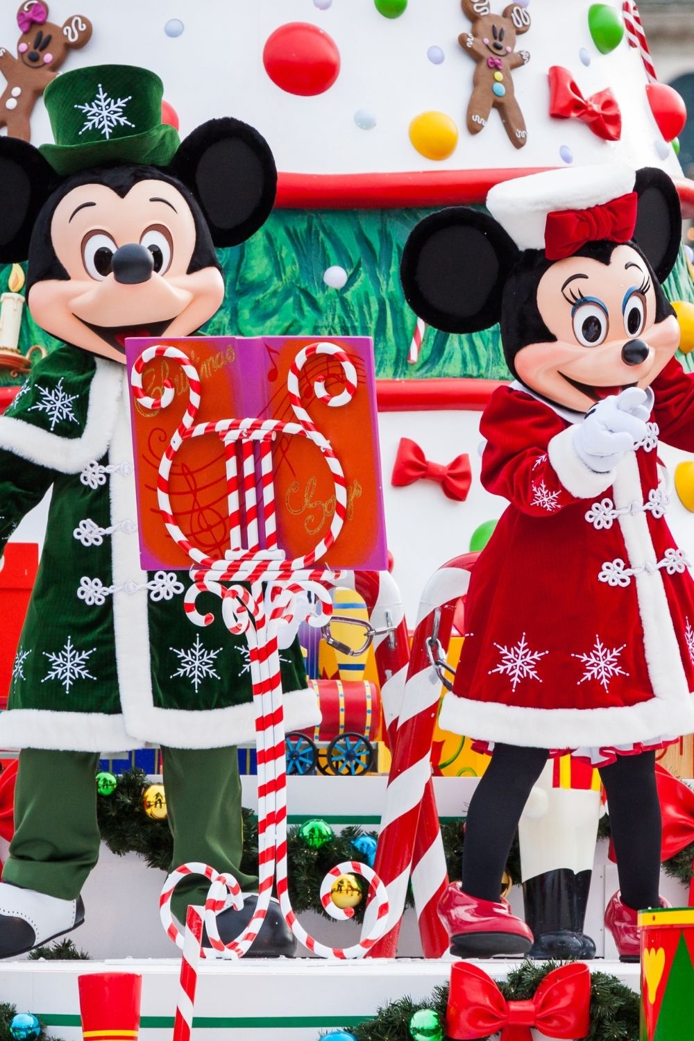 Mickey and Minnie characters on a Christmas parade float