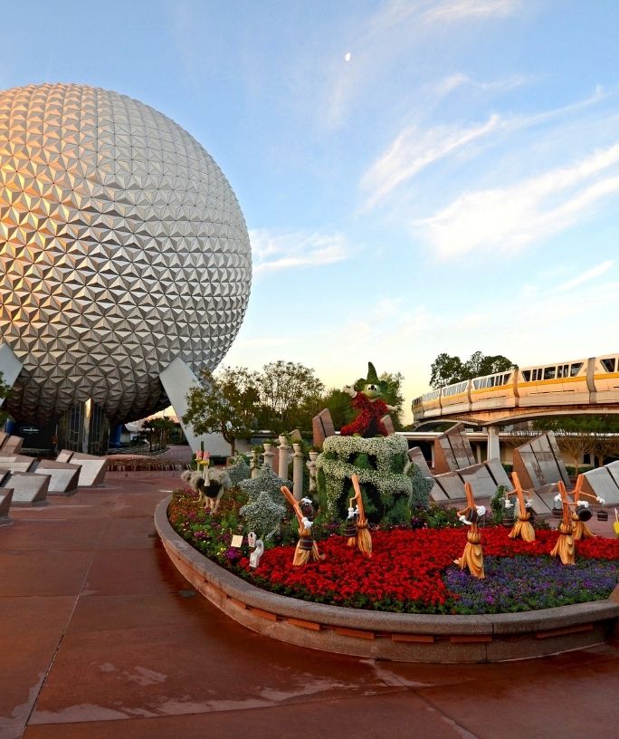 the entrance of Epcot, with spaceship earth in the background
