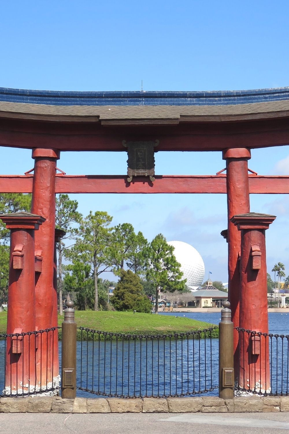 a view from the Japan pavilion at Epcot, looking across the World Showcase lagoon at Spaceship Earth