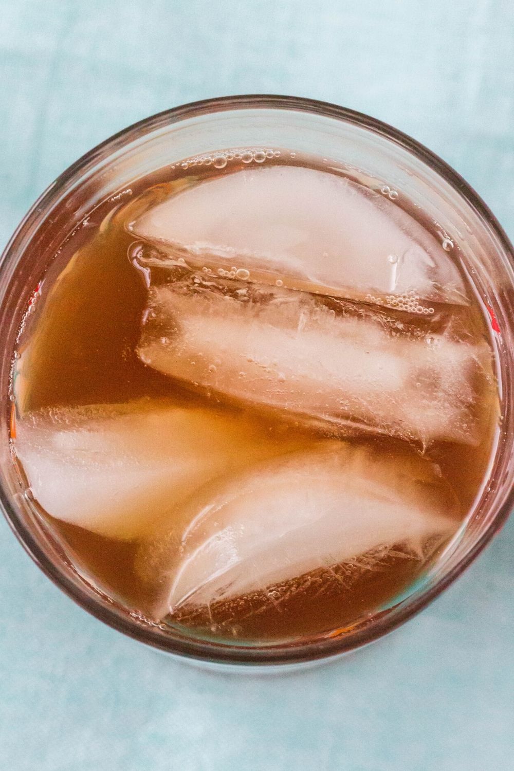 overhead view of the mixed ingredients for this Galaxy's Edge drink, served over ice