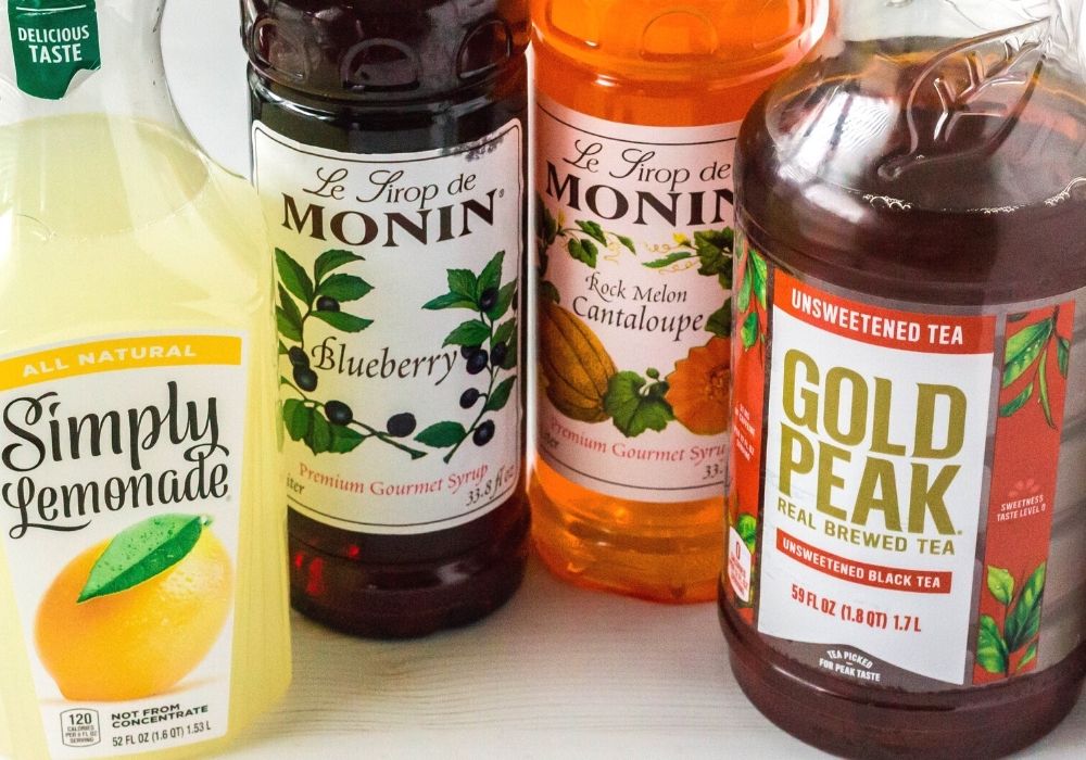 Ingredients for Tatooine Sunset drink, including lemonade, unsweetened tea, blueberry syrup, and cantaloupe syrup