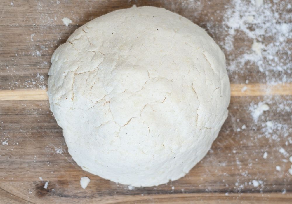 a round ball of dough for making arepas