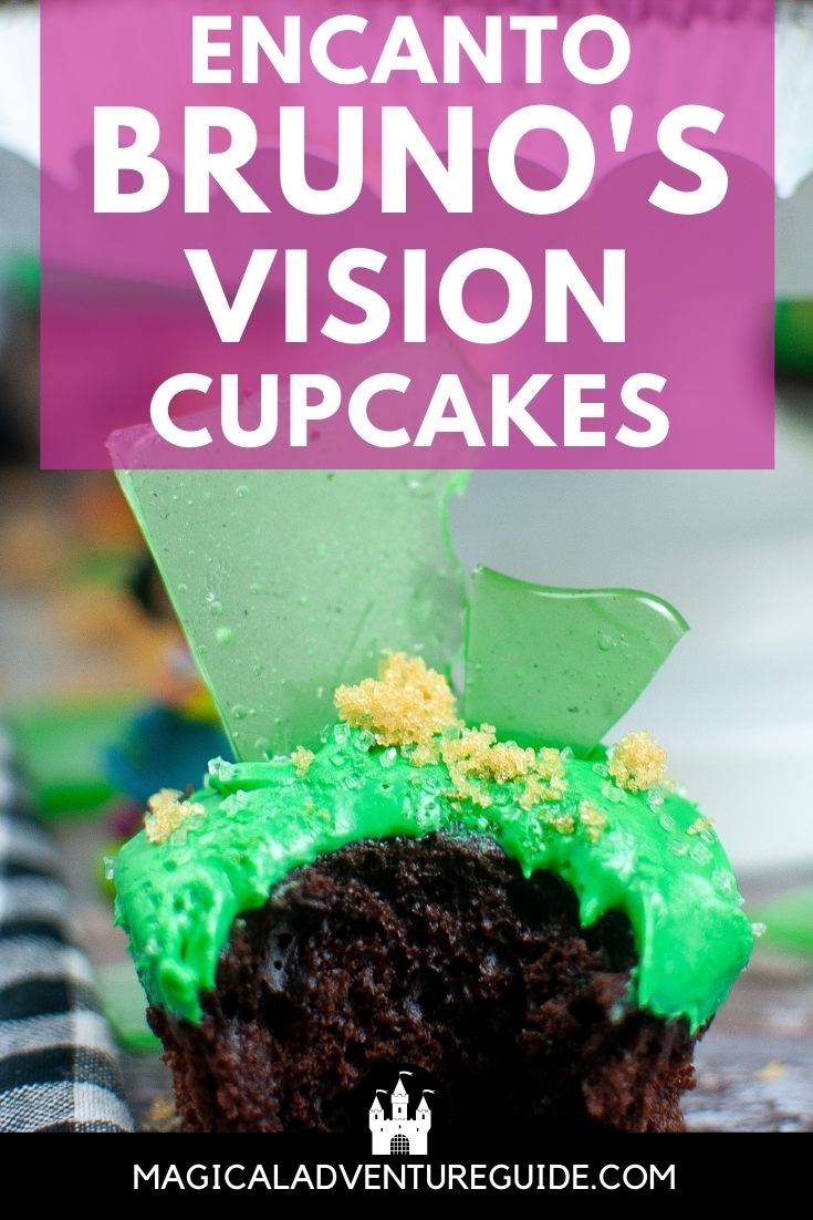 Encanto cupcake with a bite taken out of it. An overlay reads, "Encanto Bruno's Vision Cupcakes"