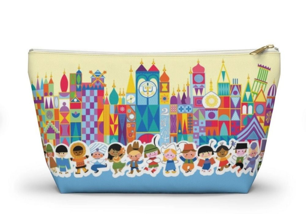 zipper bag featuring the scene and dolls from it's a small world ride
