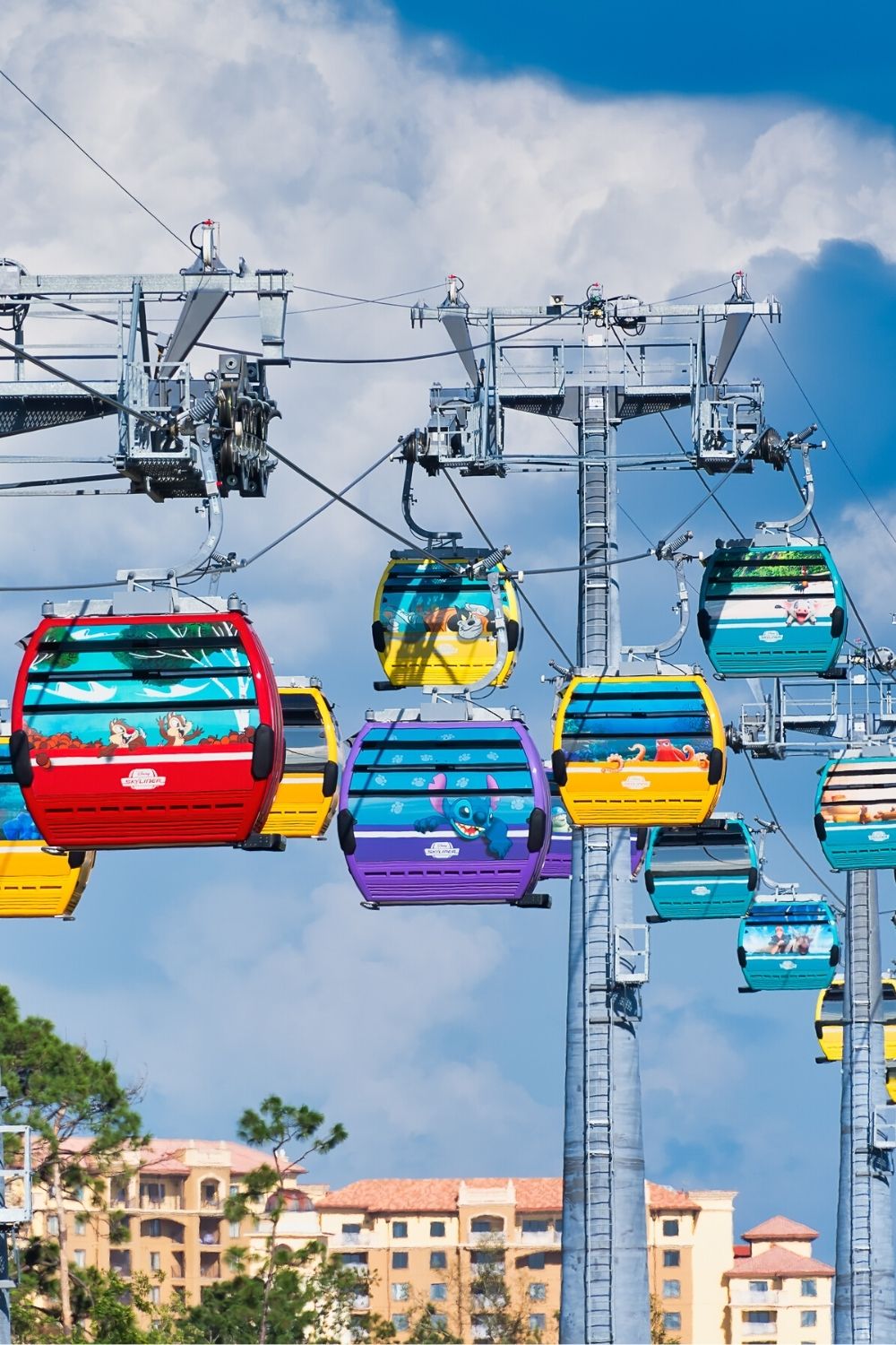 The Disney World Skyliner gondola cable car system on a sunny day