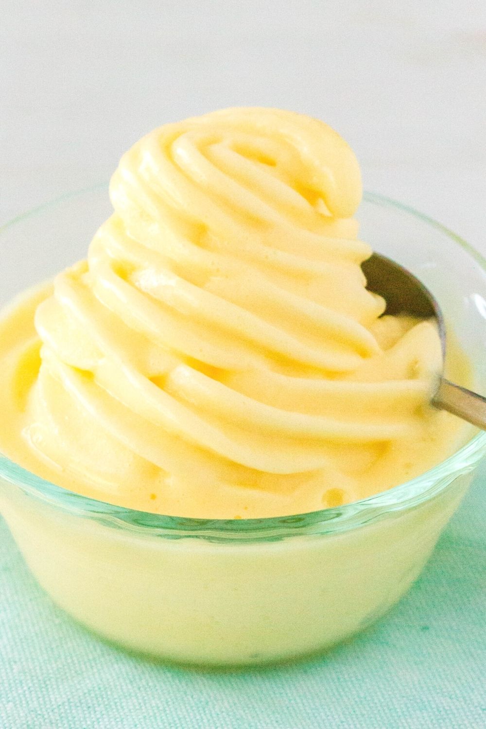 copycat Disney World Dole Whip swirled into a small Pyrex glass bowl