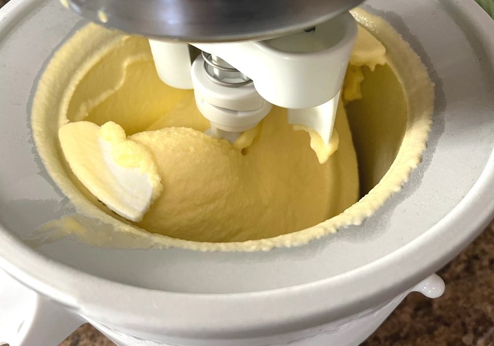 pineapple soft serve like Disney World's being churned in a home kitchen ice cream maker