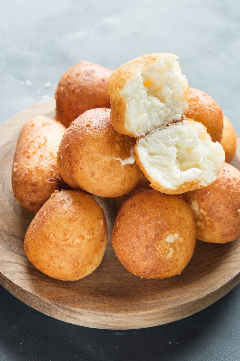 a wooden bowl filled with Colombian bunuelos, similar to what was served in Encanto