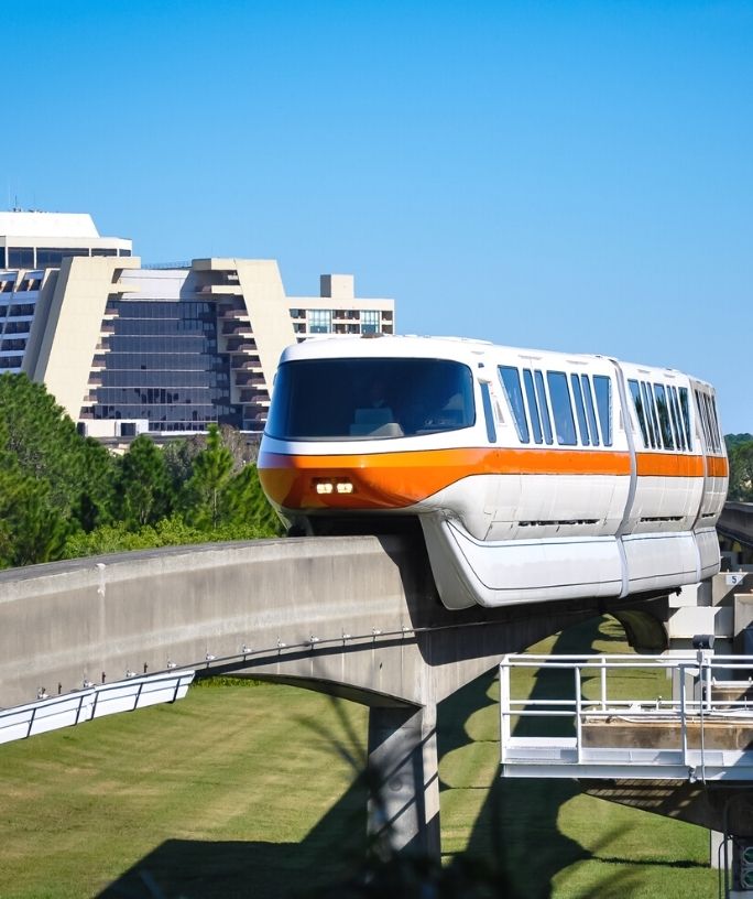 a monorail passes in front of the Disney Contemporary Resort Hotel.