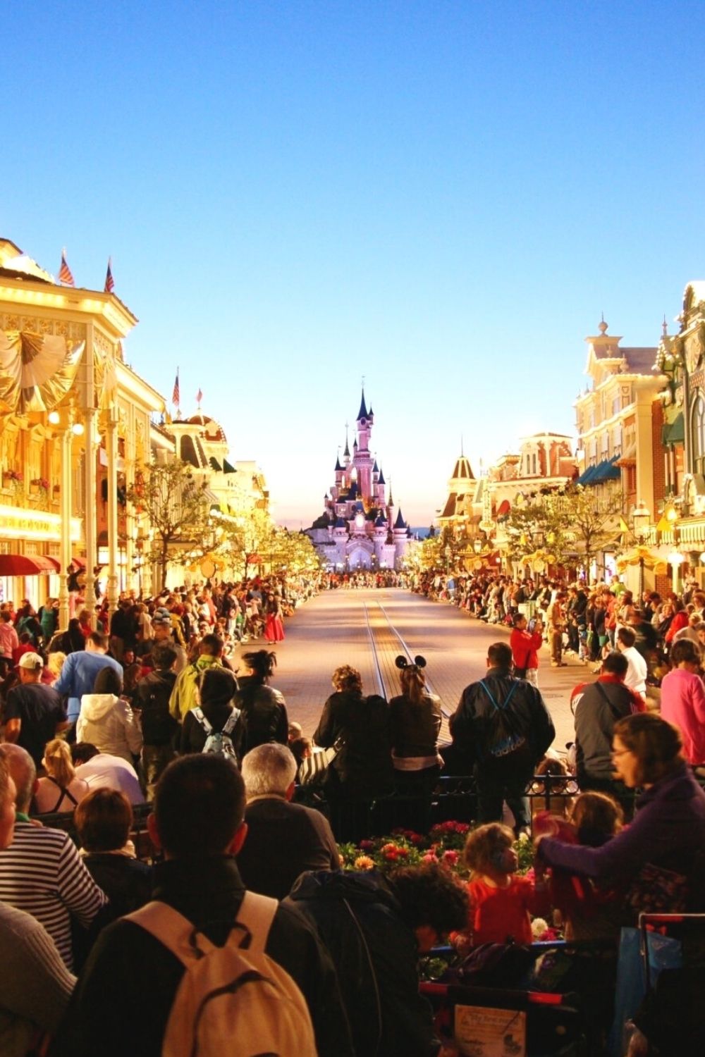 guests congregating on Main Street USA in Magic Kingdom