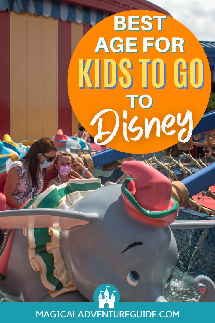 A woman and her child ride the Dumbo ride at Magic Kingdom in Disney World
