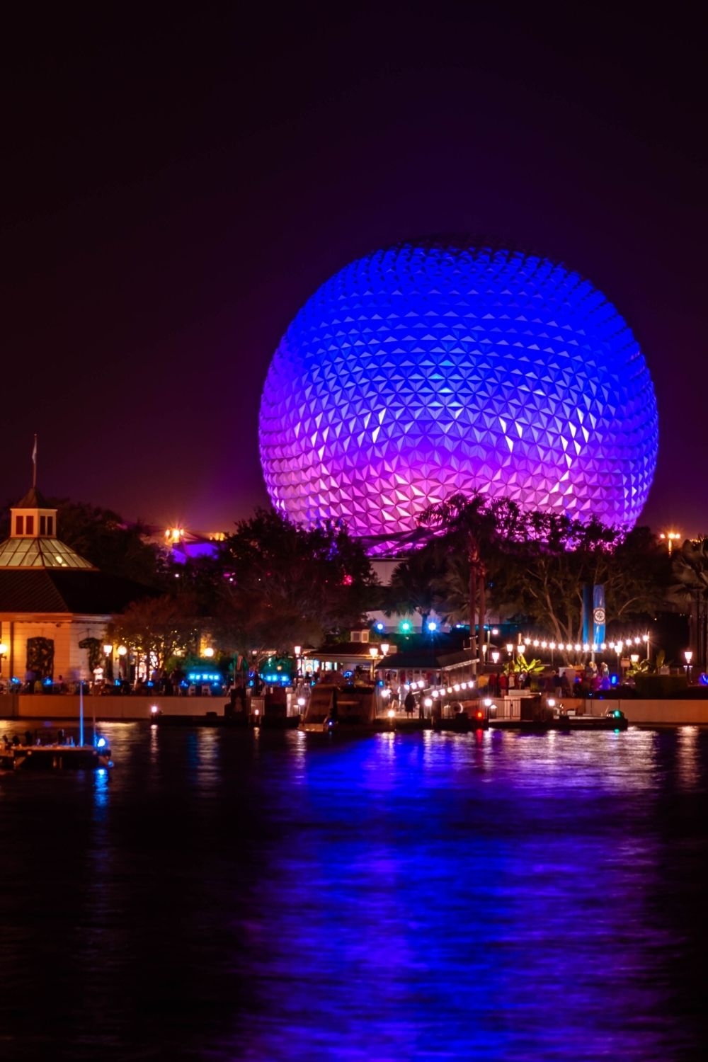 Spaceship Earth at Epcot lit up at night