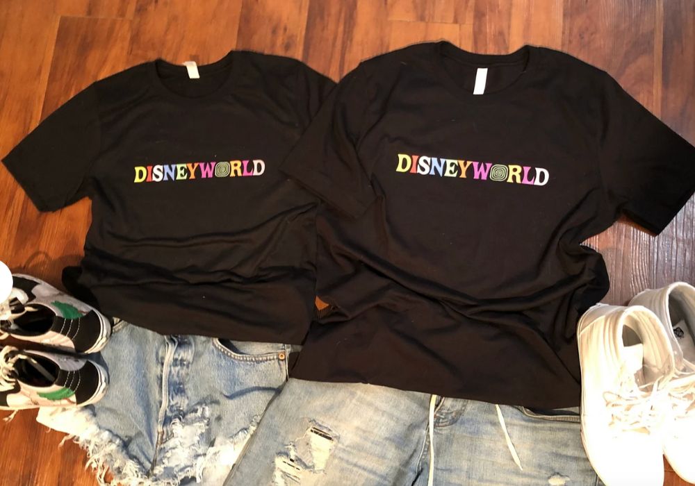 black t-shirts with "Disney World" on them in multi-colored letters
