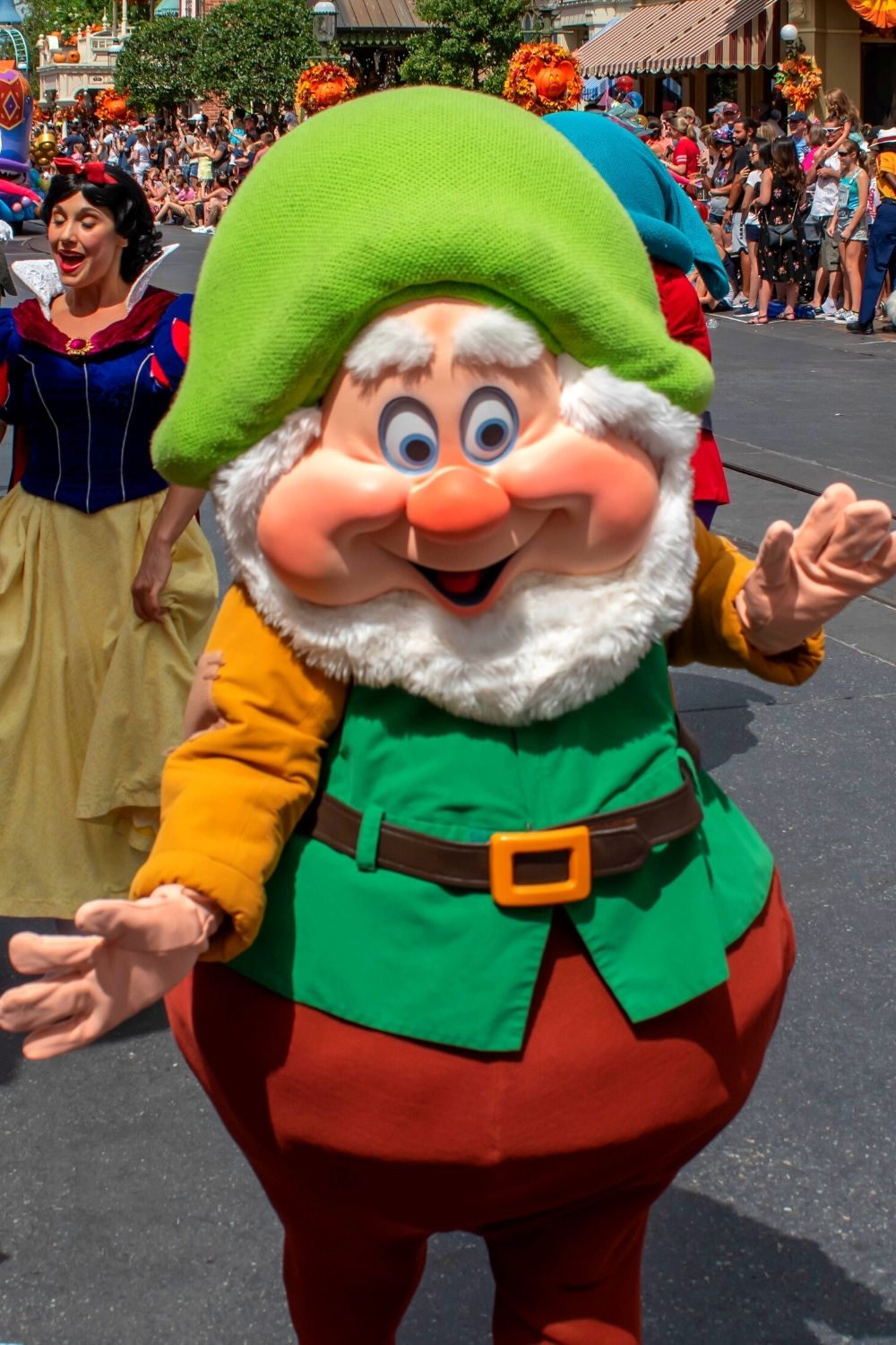 Snow White and one of the Seven Dwarfs during a parade at Disney World