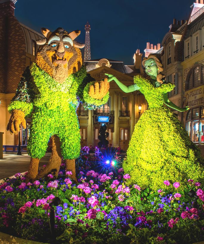 beast and belle topiaries at france pavilion in epcot