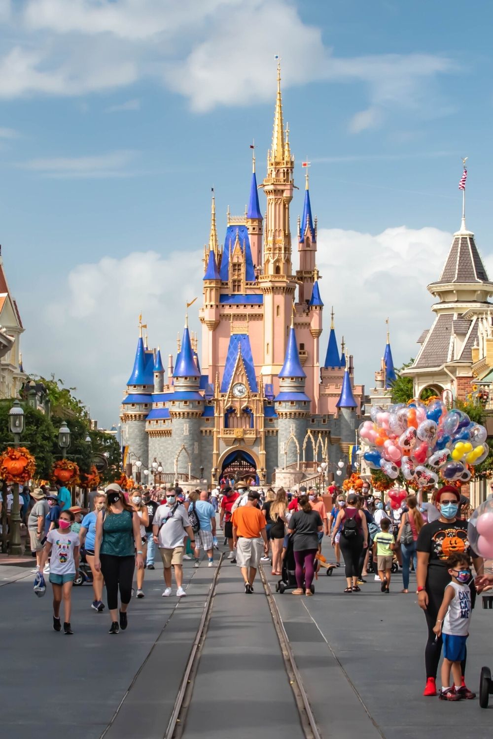 guests at Disney World's Magic Kingdom during the fall season