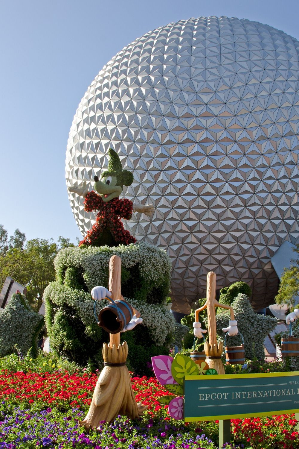 Mickey topiary in front of Spaceship Earth at Epcot