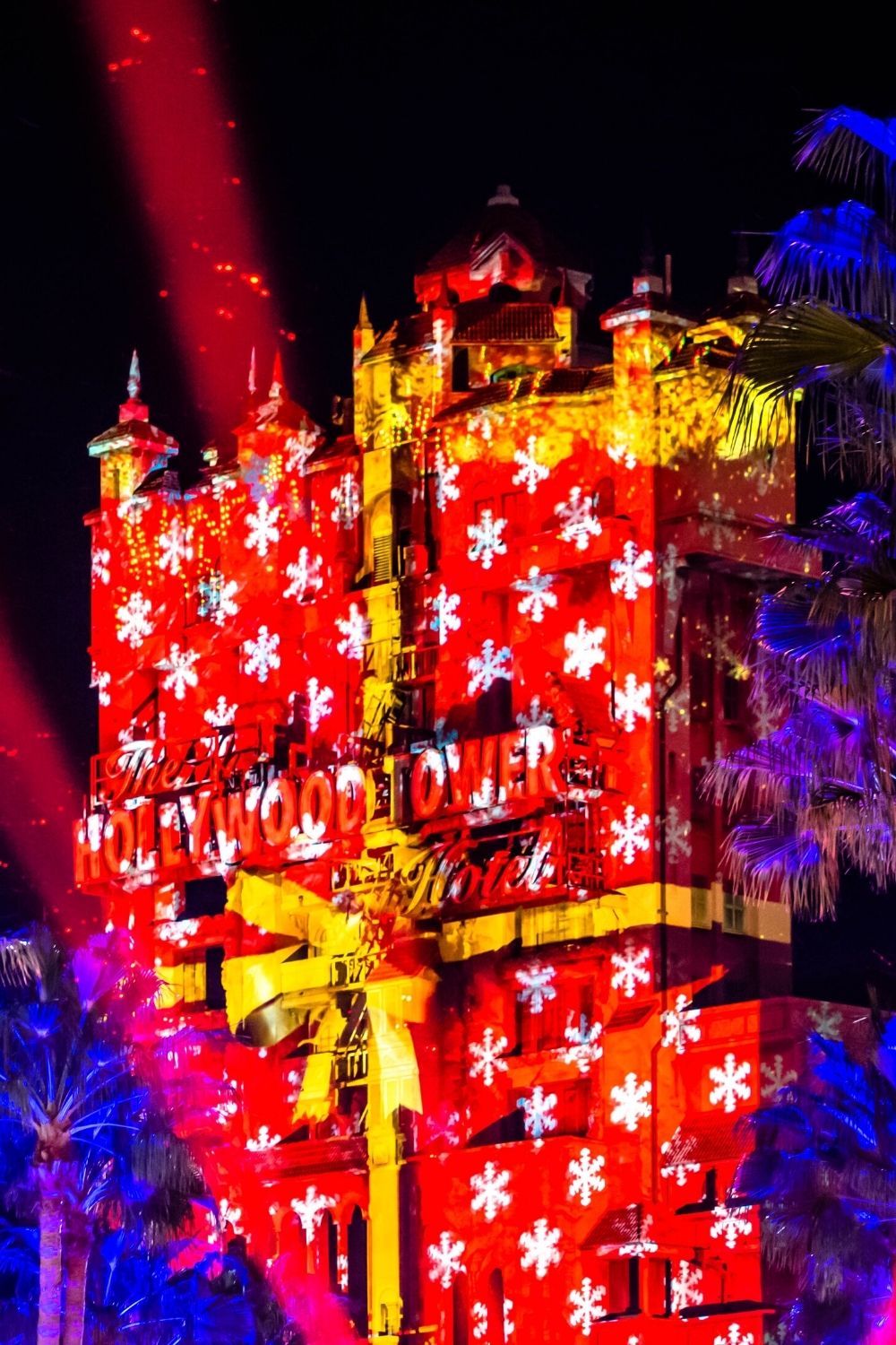 Hollywood Tower Hotel lit up with Christmas projections at Disney's Hollywood Studios