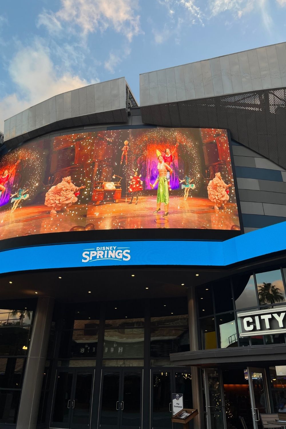 a screen advertising Drawn to Life at Disney Springs