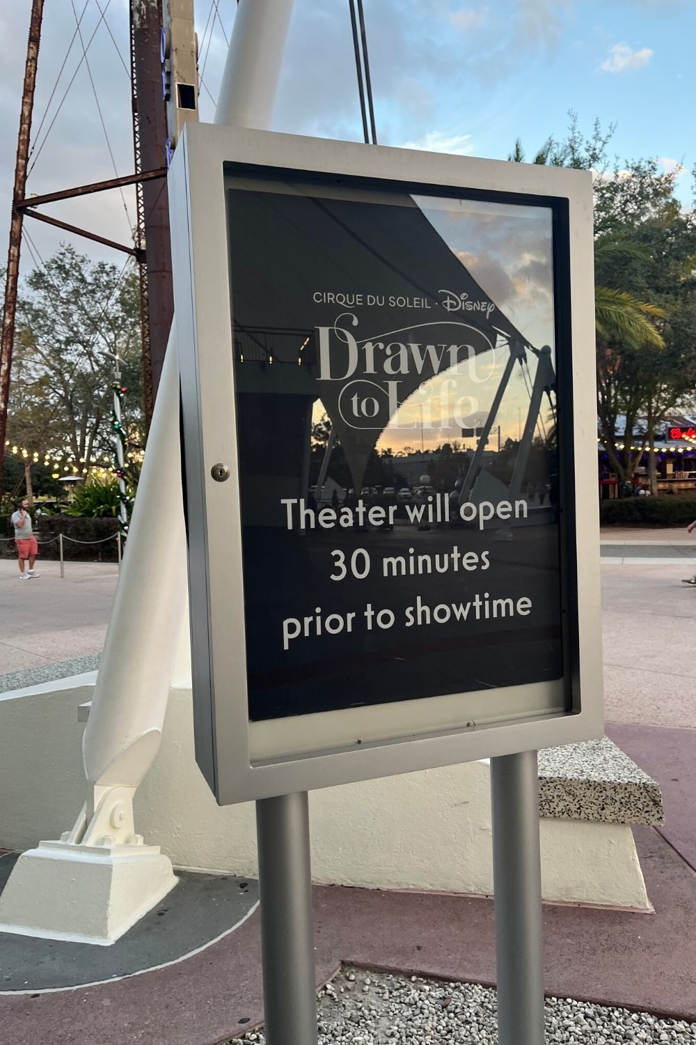 sign showing that the Cirque du Soleil theater opens 30 minutes prior to Drawn to Life performance
