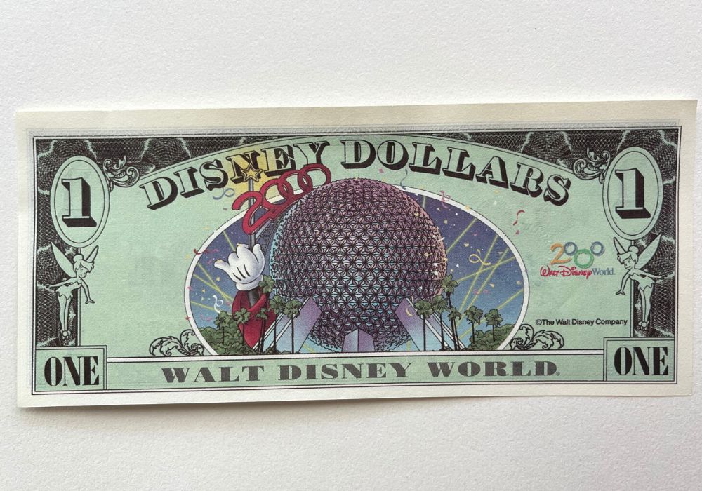 the back of a Disney Dollar featuring Spaceship Earth at Epcot from the year 2000