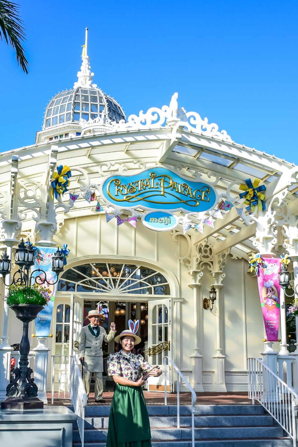 staff outside of the Crystal Palace restaurant at Tokyo Disney, another honeymoon location