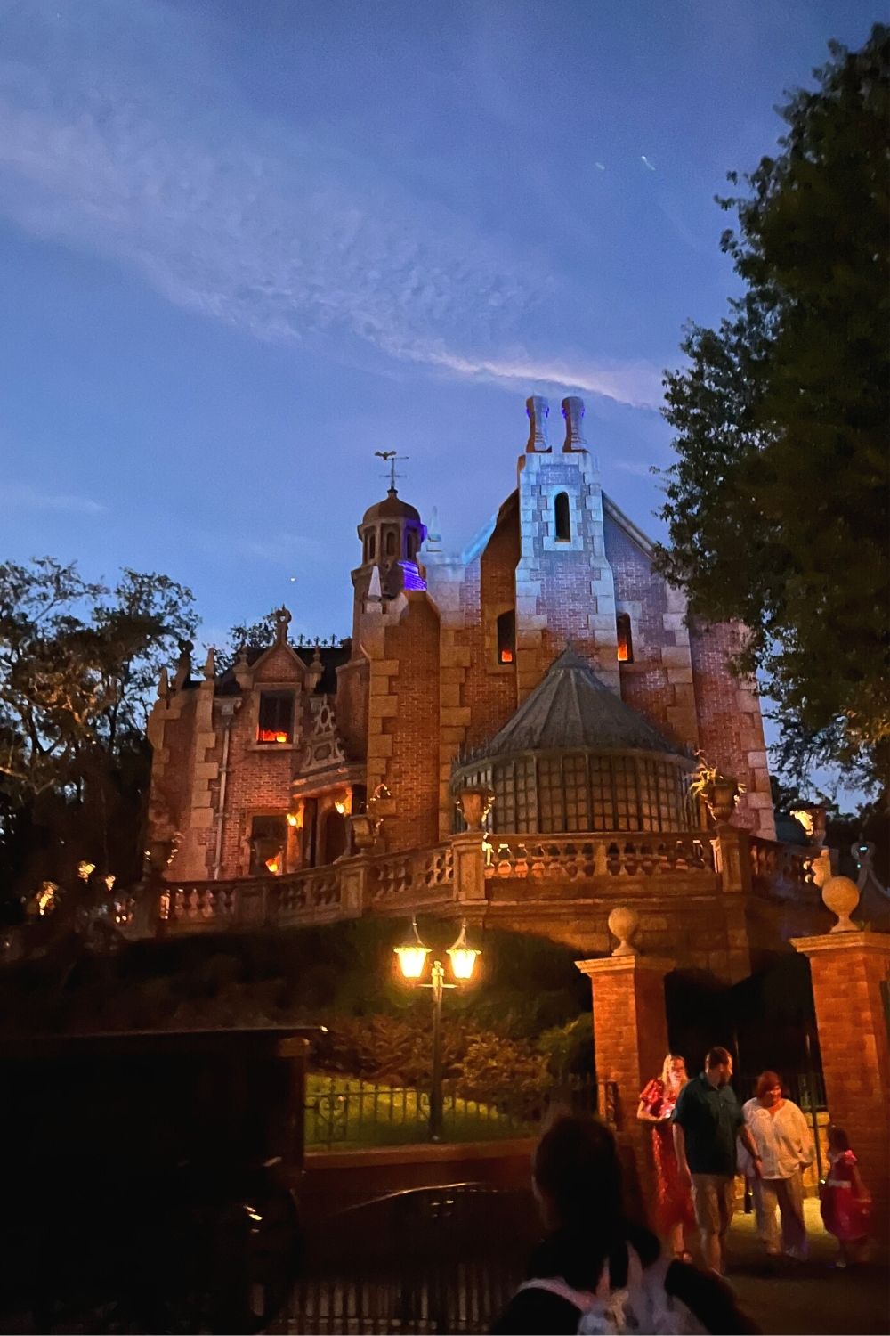 Haunted Mansion attraction at dusk