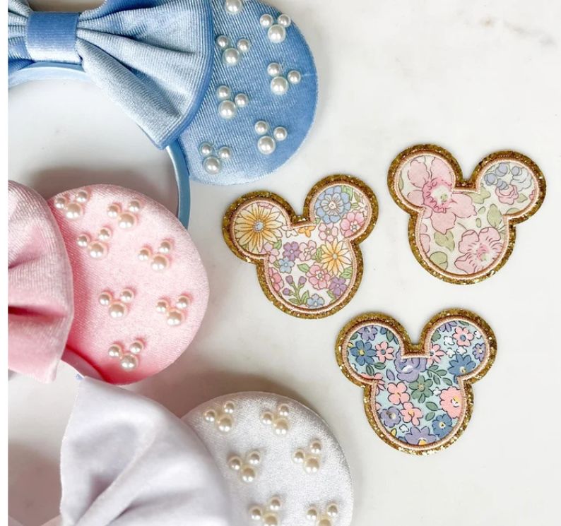 picture of disney patches featuring mickey shape and floral patterns.  
