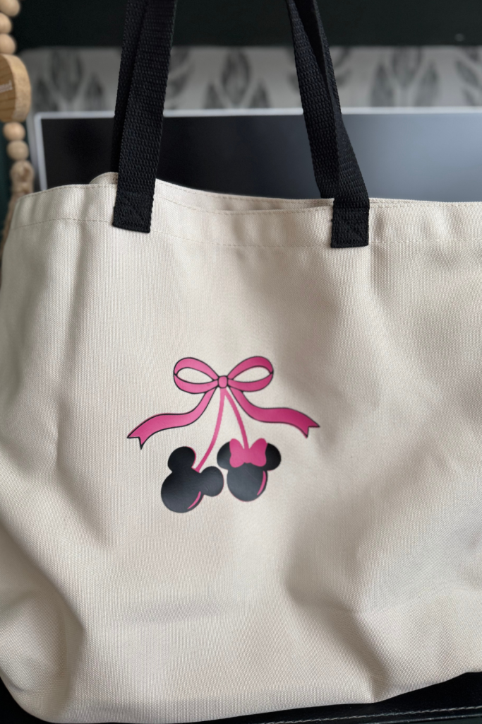 picture of a pink bow and minne and mickey heads shaped like cherries