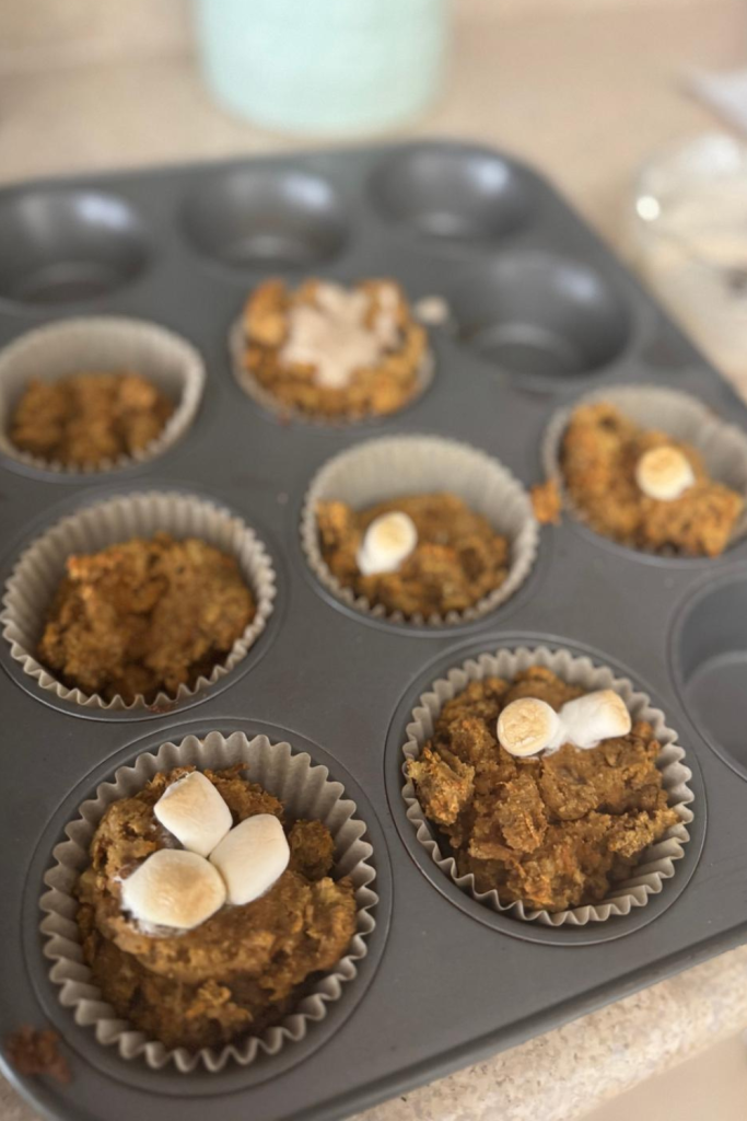 picture of carrot cake mufins with frosting and marshmallows