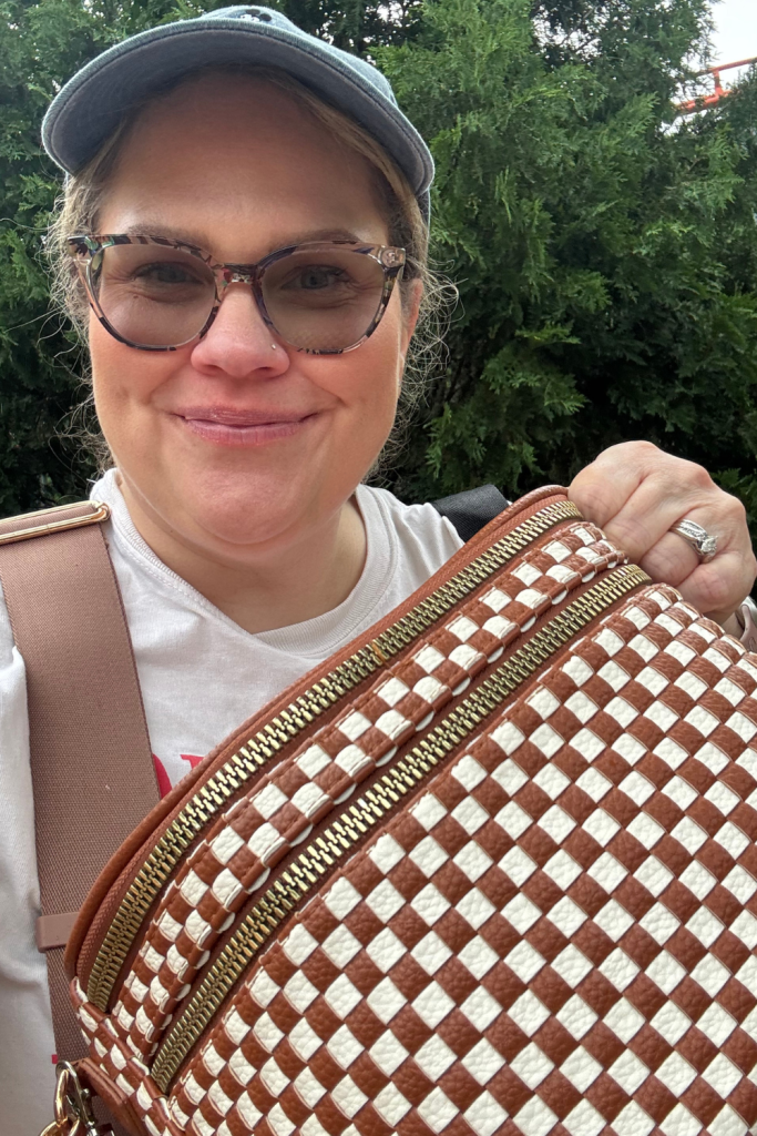 picture of a female holding a purse